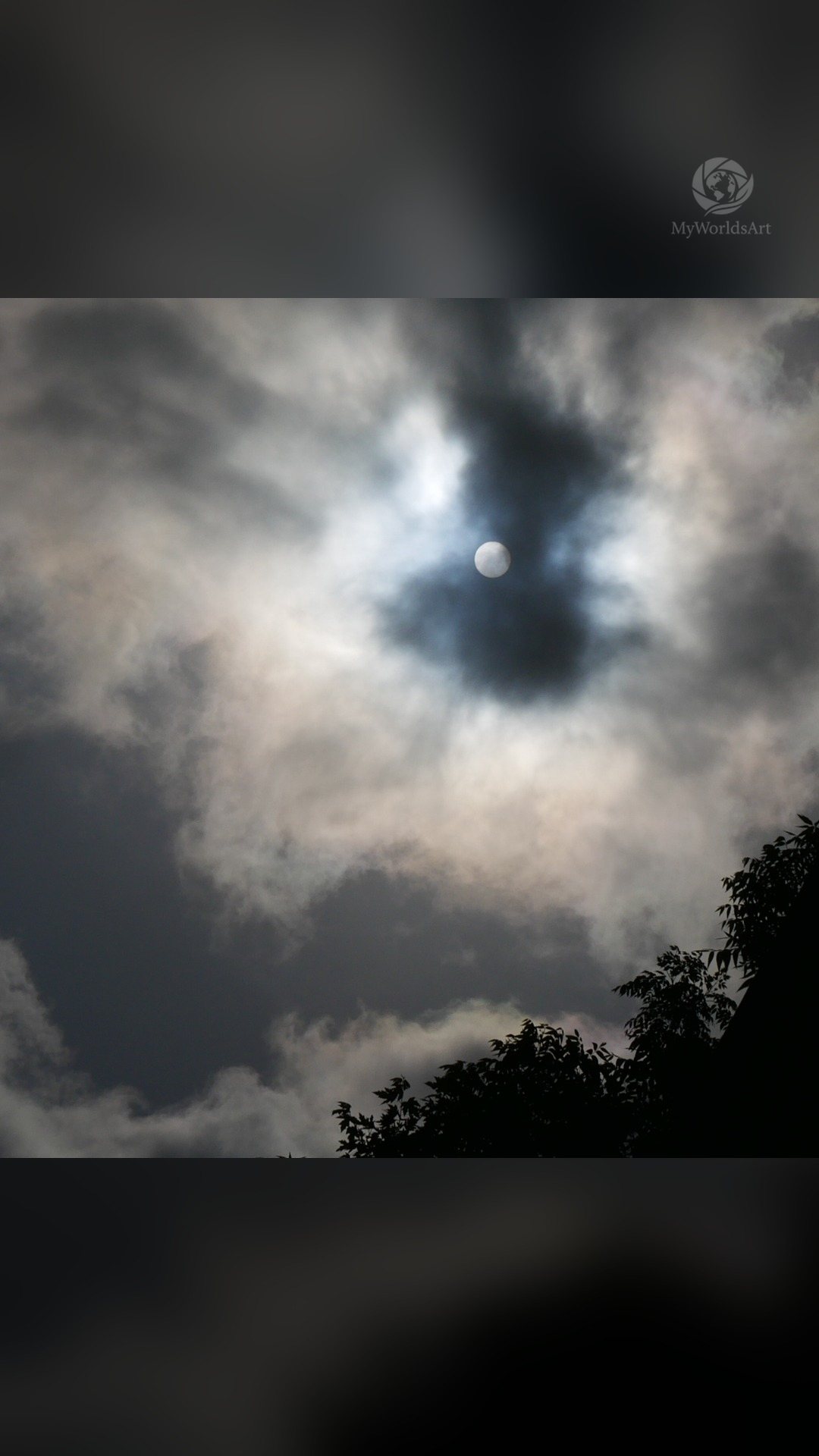 Sun behind clouds